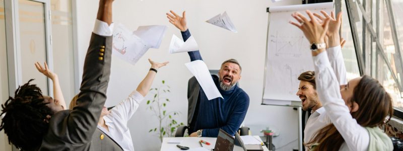 Company celebrating the optimization and success of marketing a business